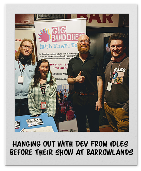 A picture of people hanging out with the band