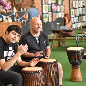 Otis and Lee banging drums
